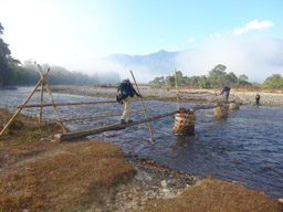 Marc and Fred crossing Namro Creek while Phu Sar watches
Past Wasandum 
Kachin State, Myanmar