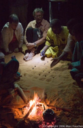 Playing a Tuareg game around the camp fire