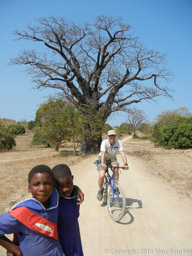 Marc riding his mountain bike past a large Baobab tree while schoolgirls watch
Likoma Island
Lake Malawi